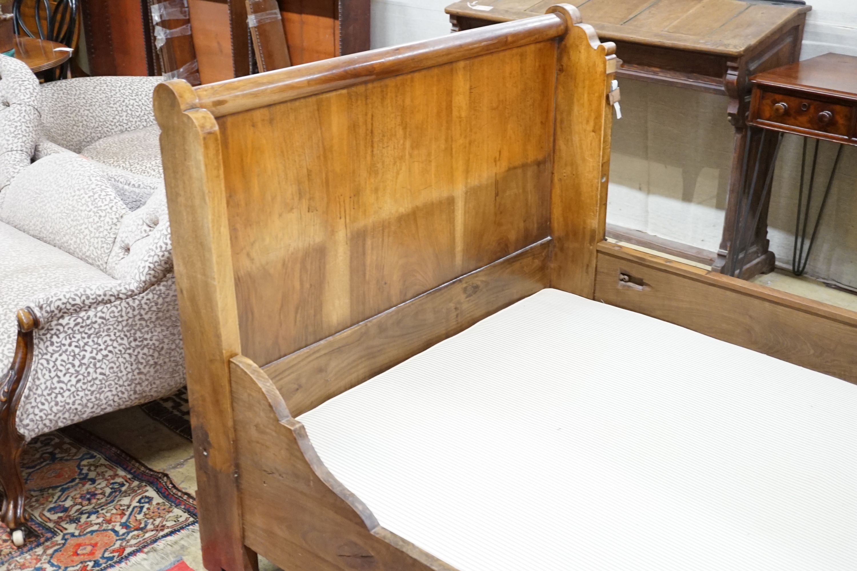 A 19th century Continental Gothic Revival mahogany sleigh bed, 209cm long, 126cm wide